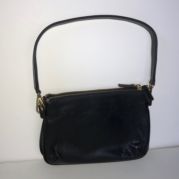 Black leather Fossil handbag with gold accents. - Picture 2 of 3